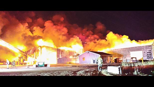 On Jan. 29, the Rapid Valley Fire Department responded to a spreading commercial structure fire. The fire escalated to a three-alarm fire with firefighters responding from a three-county area facing darkness and lack of a suitable water supply. The fire was successfully contained with one firefighter receiving minor injuries. Photo courtesy of the Rapid Valley Volunteer Fire Department.