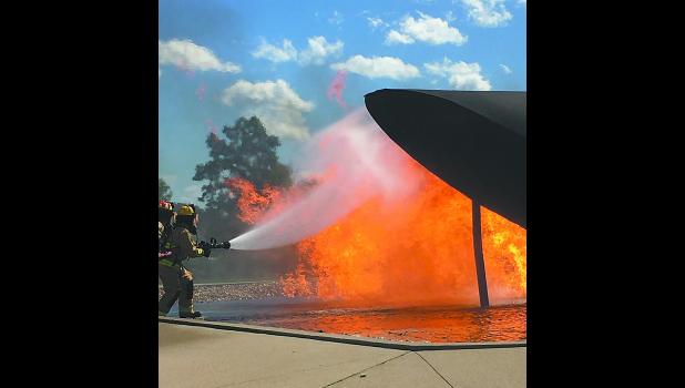 Firefighters from Joe Foss Field and South Dakota Air National Guard Crash Fire Rescue perform air rescue pit fire training. Joe Foss Field Station Captain Lonnie Albers celebrated his final pit fire training after 39 years of fire service as an Air Force, National Guard, career, and volunteer firefighter.