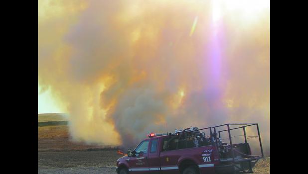 Denison and Dow City fire departments were called to field fire and combine fire on Oct. 15. Photo by Jim Clark.